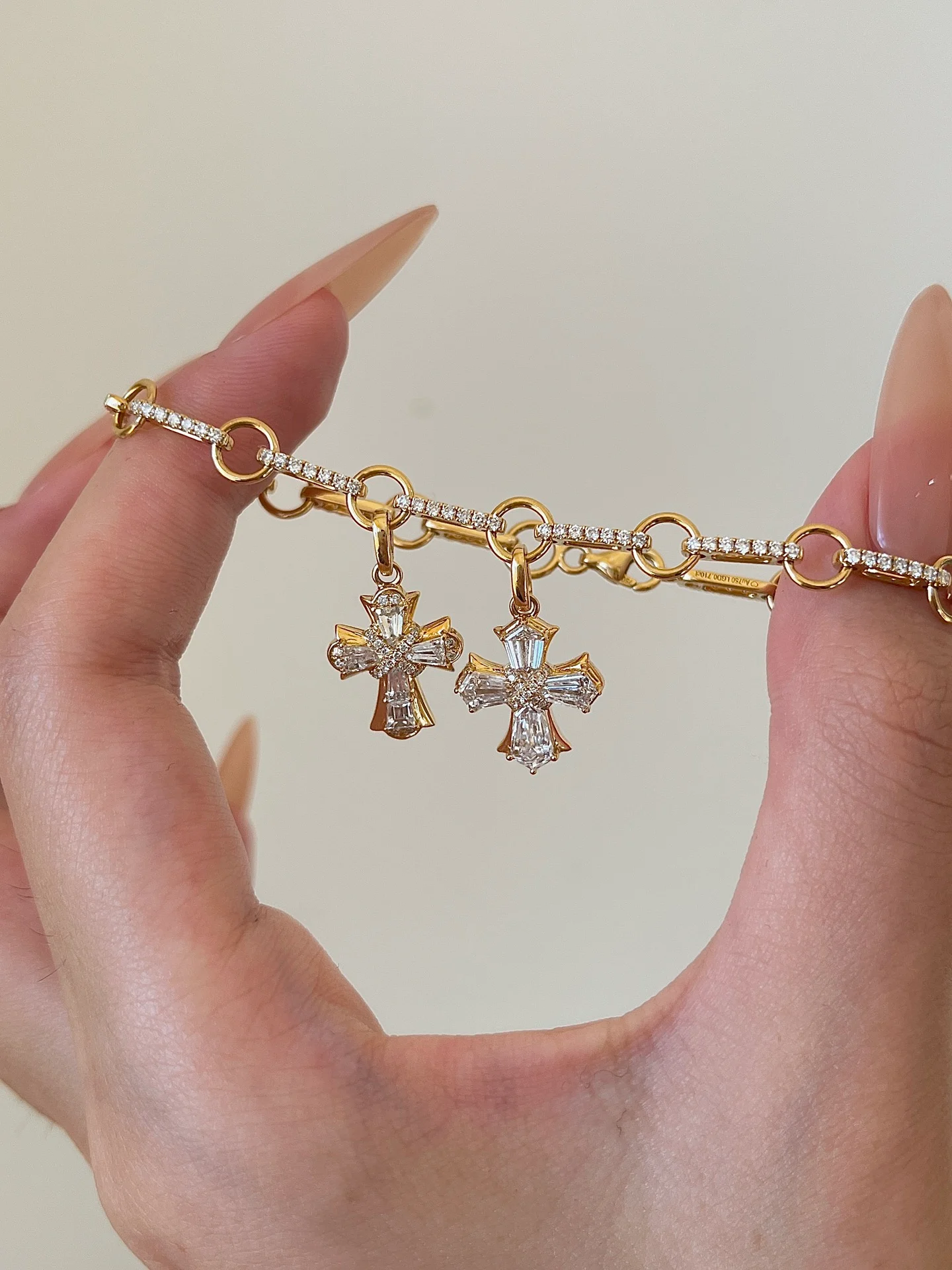 Cross-charm bracelet 001 · Charm detail (supplied photograph)