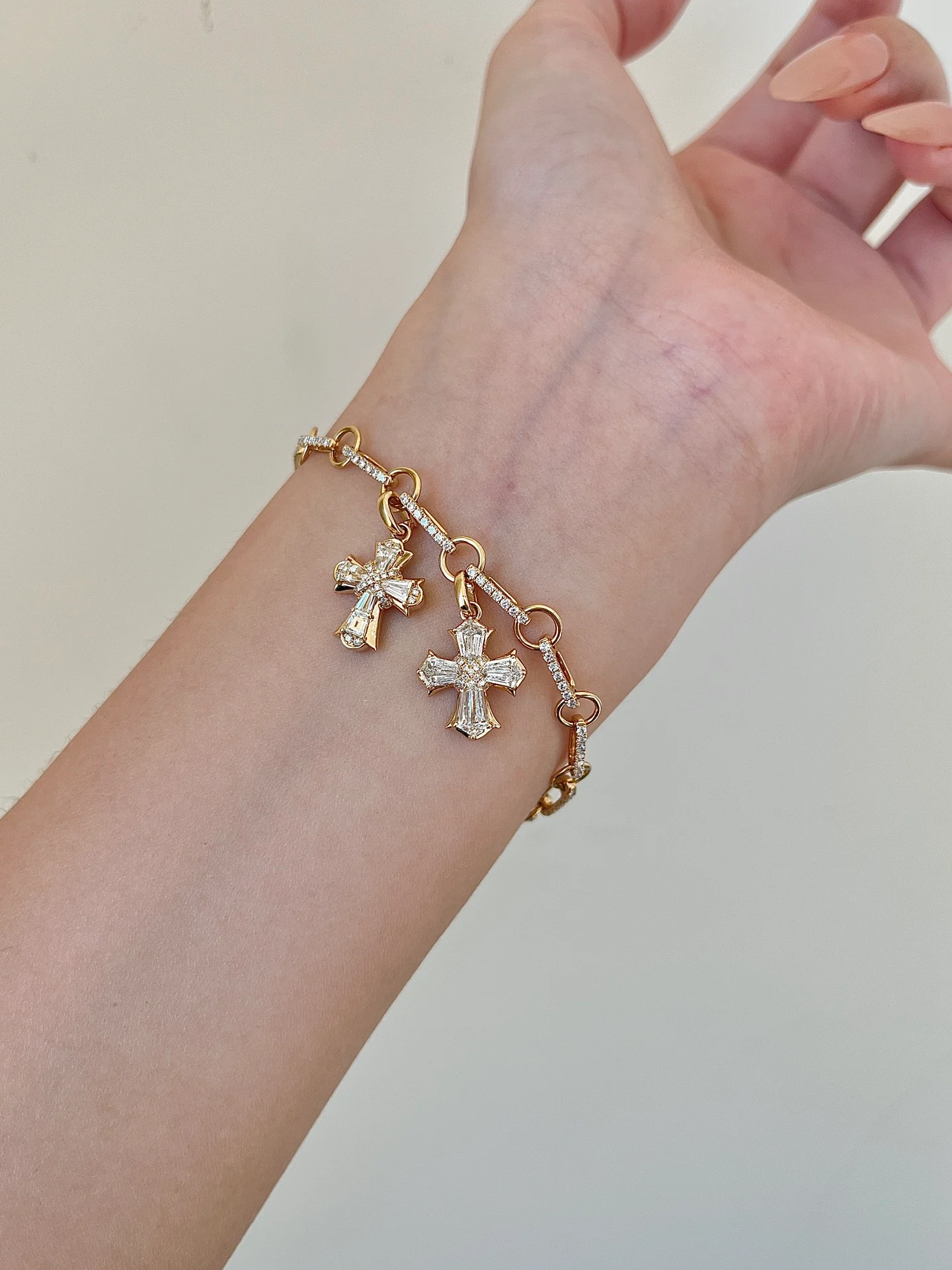 Cross-charm bracelet 001 · On the wrist (supplied photograph)