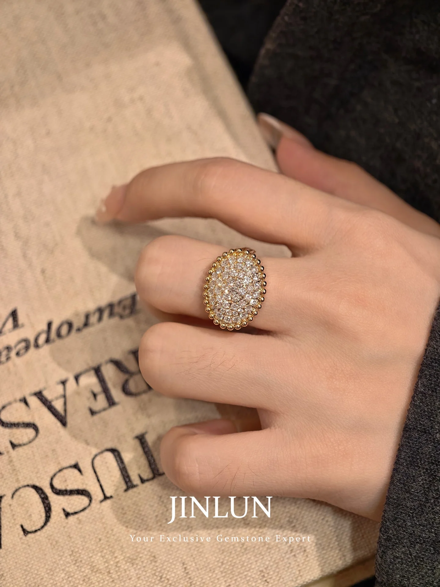 Round-face ring 001 · Worn close view (supplied photograph)